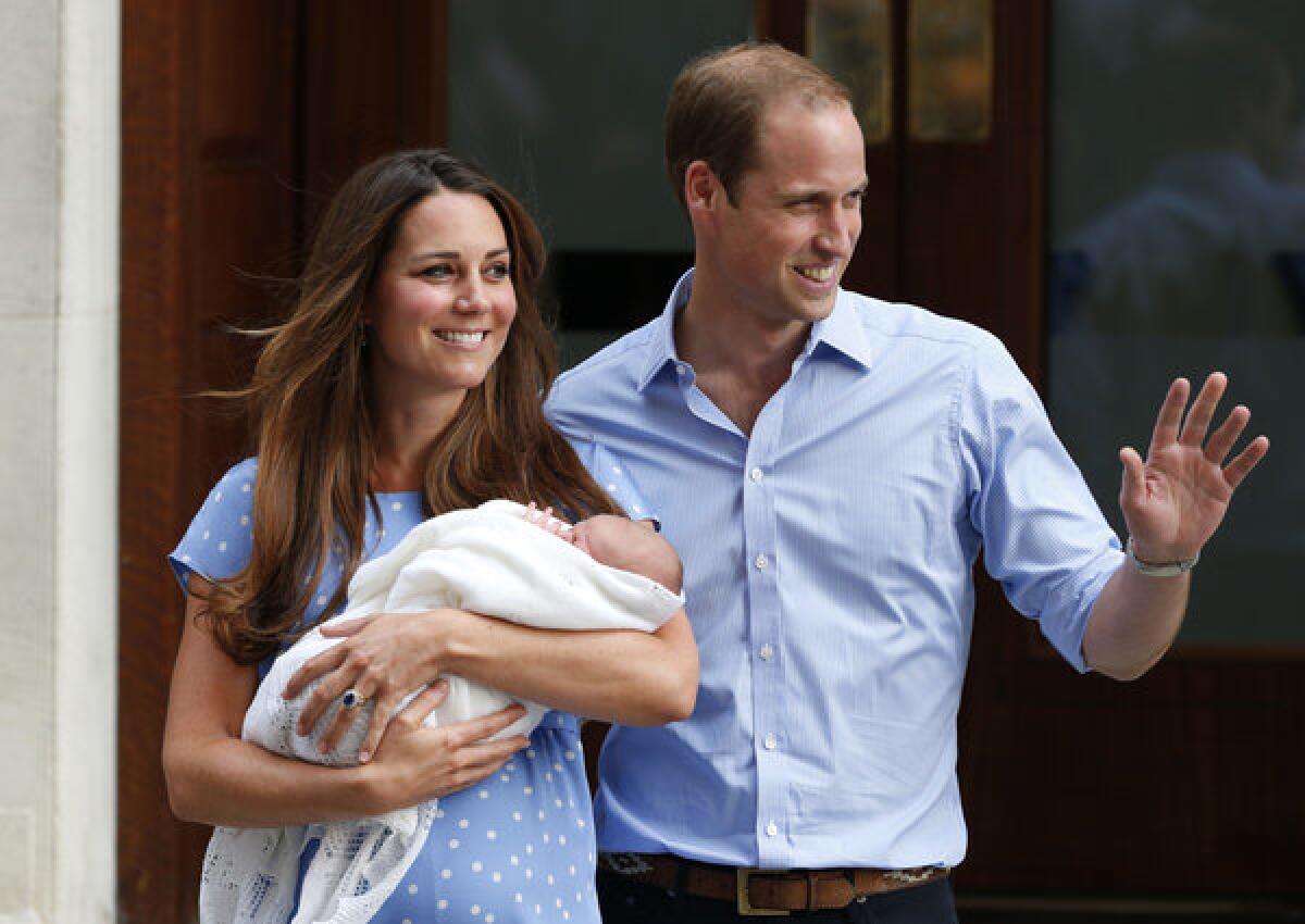 Britain's Prince William and wife Kate, Duchess of Cambridge, hold Prince George of Cambridge outside of St. Mary's Hospital in London where the duchess gave birth.