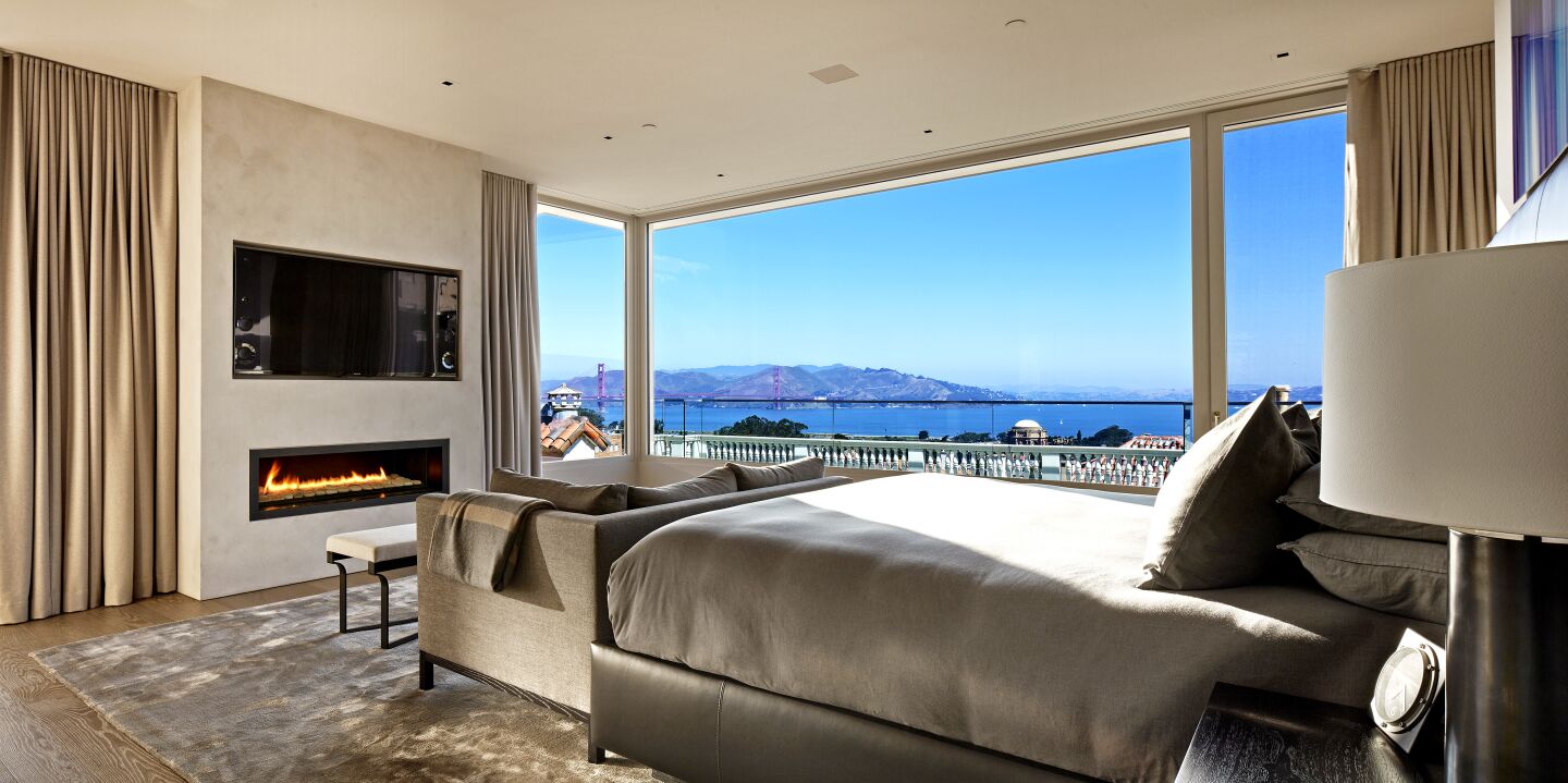 A bedroom inside the home with expansive views of San Francisco Bay