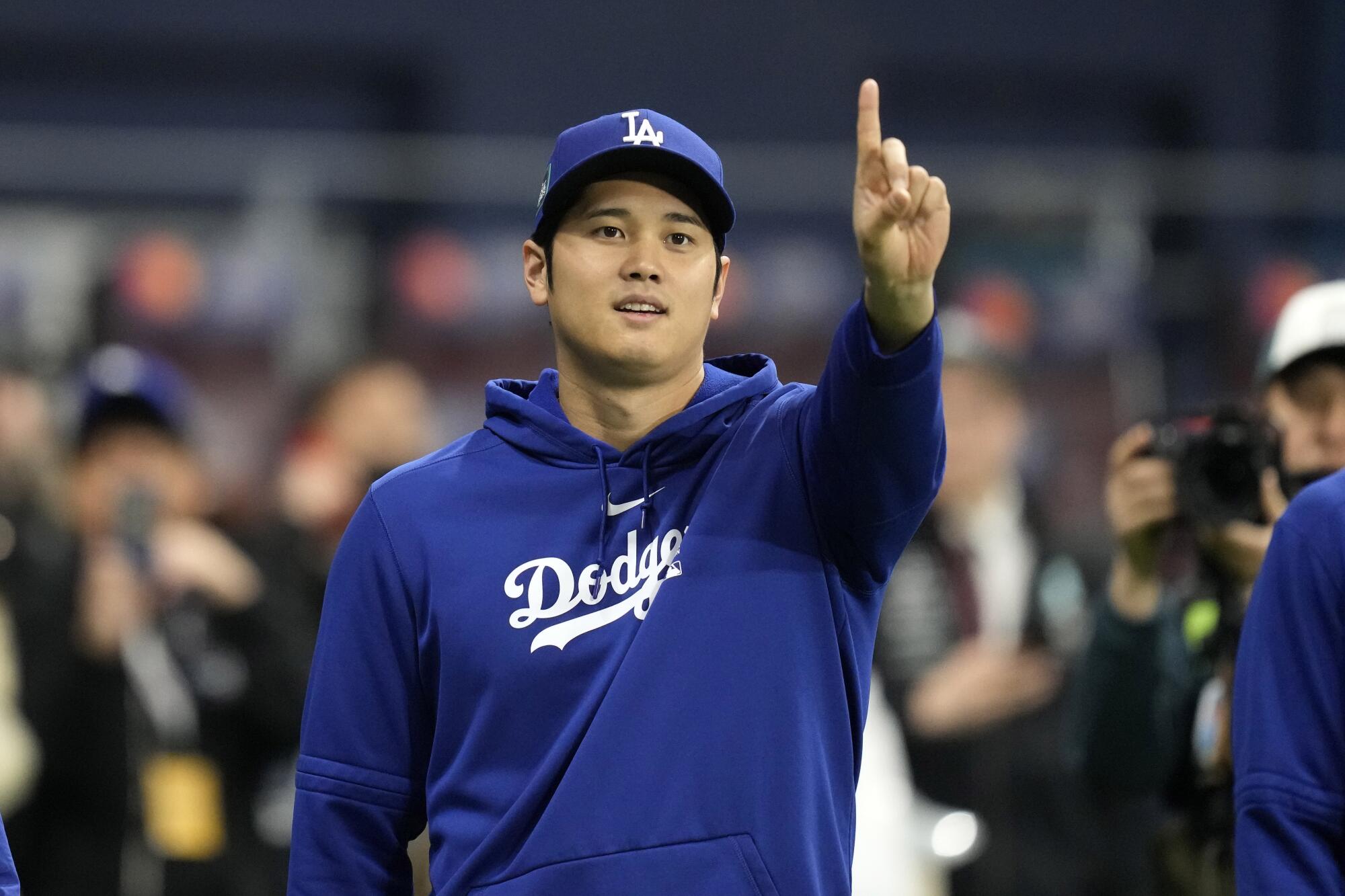 Dodgers star Shohei Ohtani gestures before a game against the San Diego Padres in South Korea on March 20.