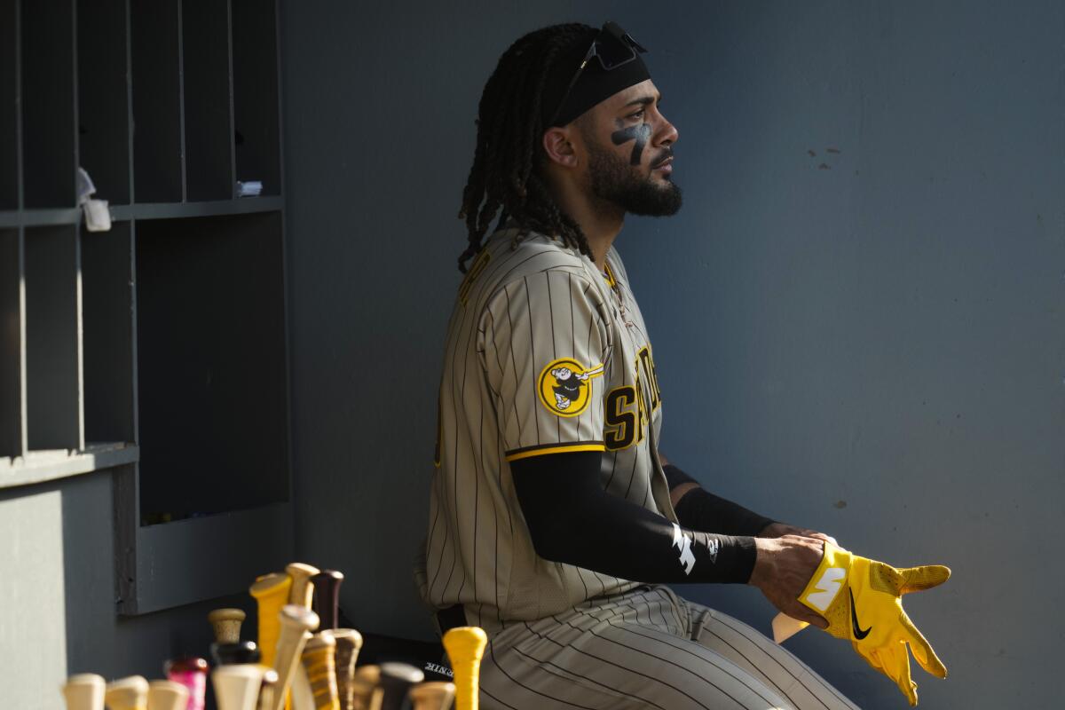 San Diego Padres star Fernando Tatis Jr. sits in the dugout in the fifth inning Saturday.