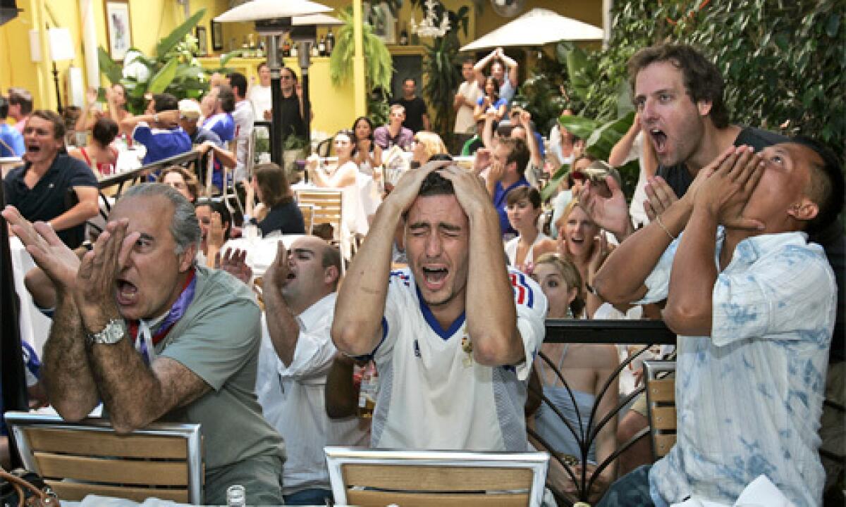 Fans react at the Cafe Marly on Melrose, as France misses a penalty kick en route to a loss to Italy in the 2006 FIFA World Cup finals.