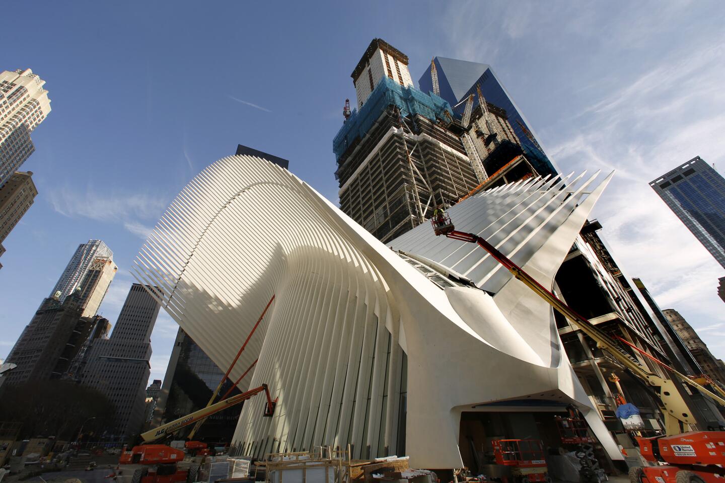 Workers put some finishing touches on the new transportation hub at the World Trade Center. The first phase of the hub, called Oculus and designed by Spanish architect Santiago Calatrava, will open on March 3, 2016.