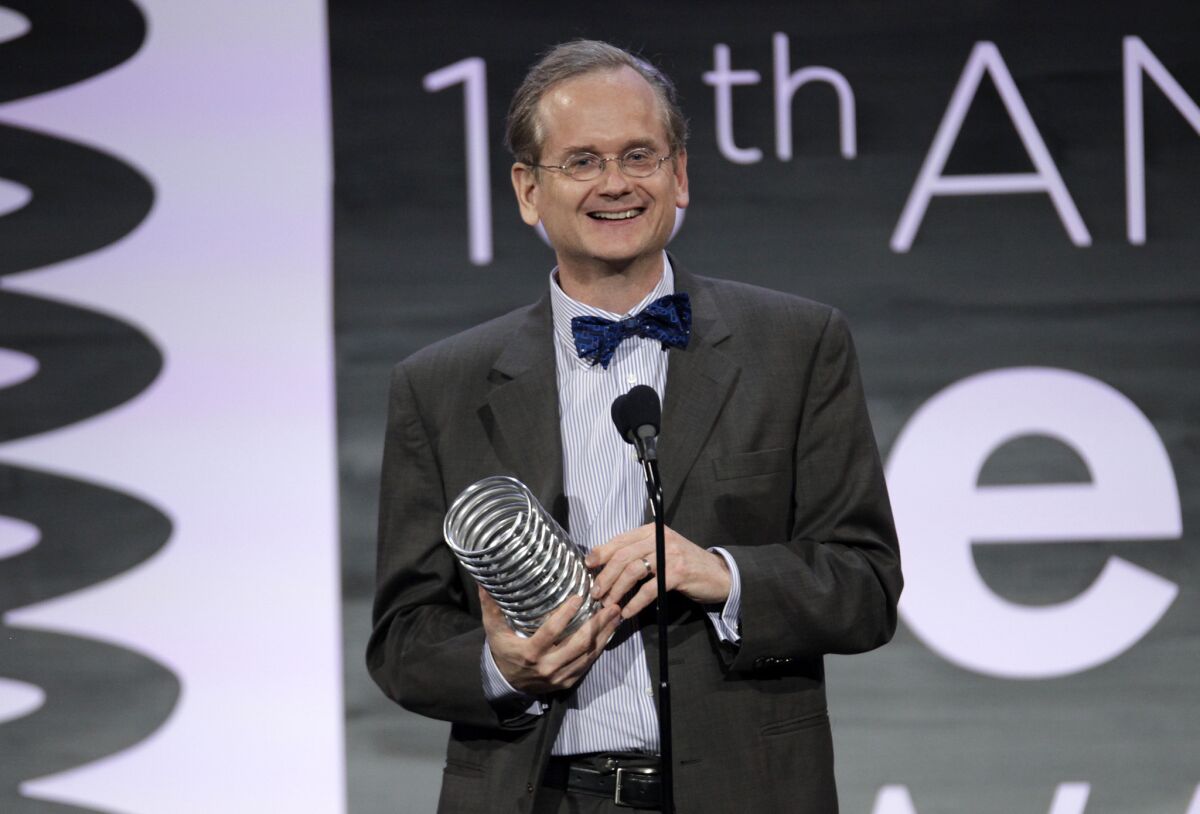 Law professor Larry Lessig appears onstage at the 2014 Webby Awards in New York.