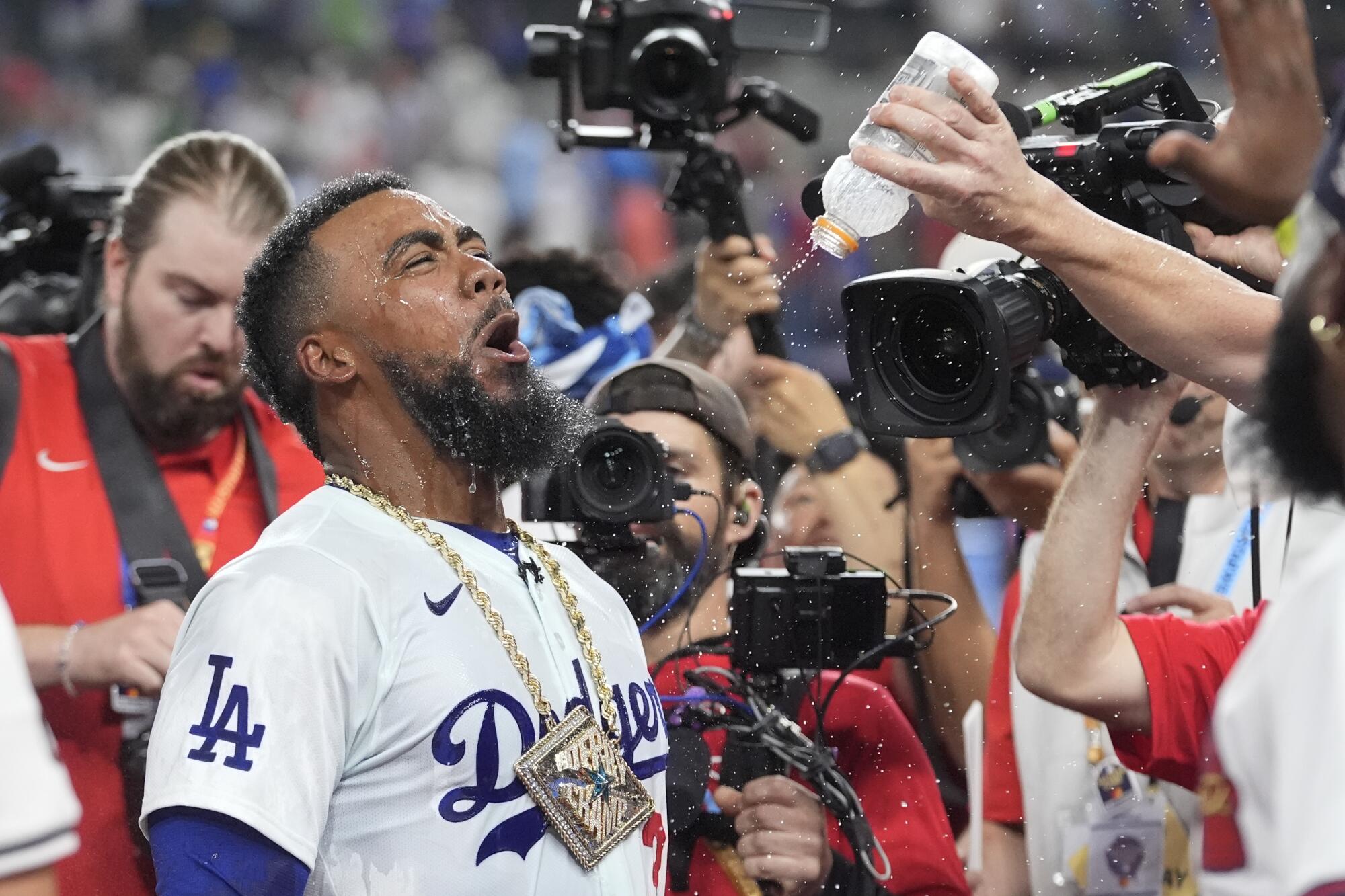 Dodgers outfielder Teoscar Hernández celebrates after winning the MLB All-Star Home Run Derby.