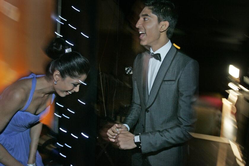 Freida Pinto and Dev Patel celebrated backstage at the 2009 Screen Actors Guild Awards after "Slumdog Millionaire" took the trophy for best cast in a motion picture.