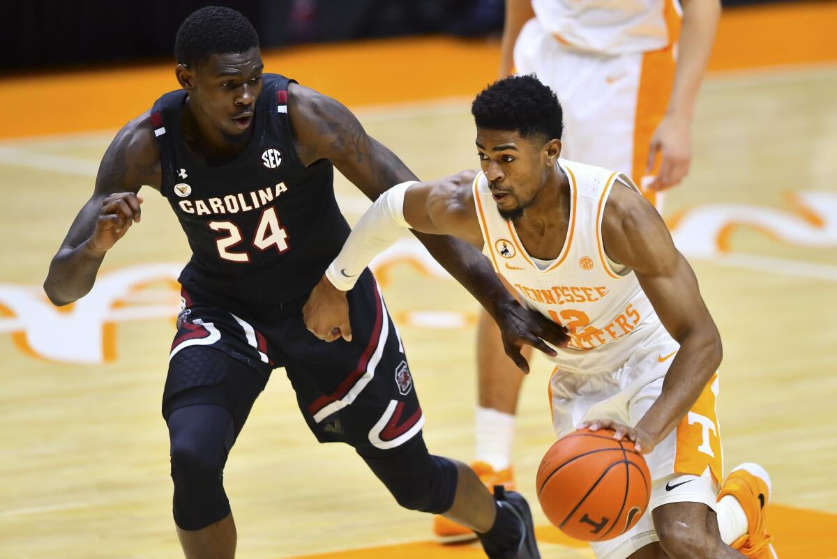 South Carolina's Keyshawn Bryant defends against Tennessee's Victor Bailey Jr.