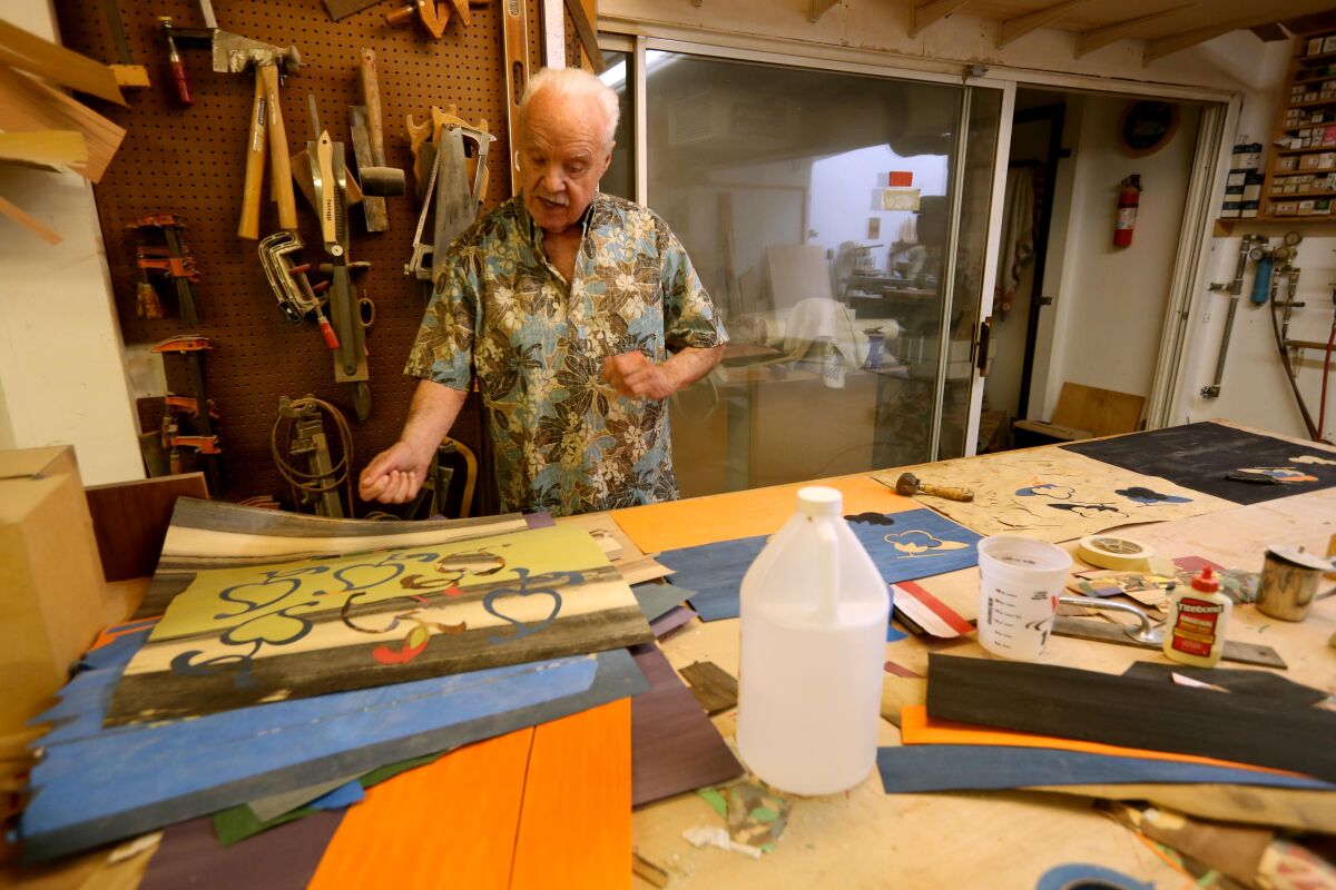 An artist works in his studio.