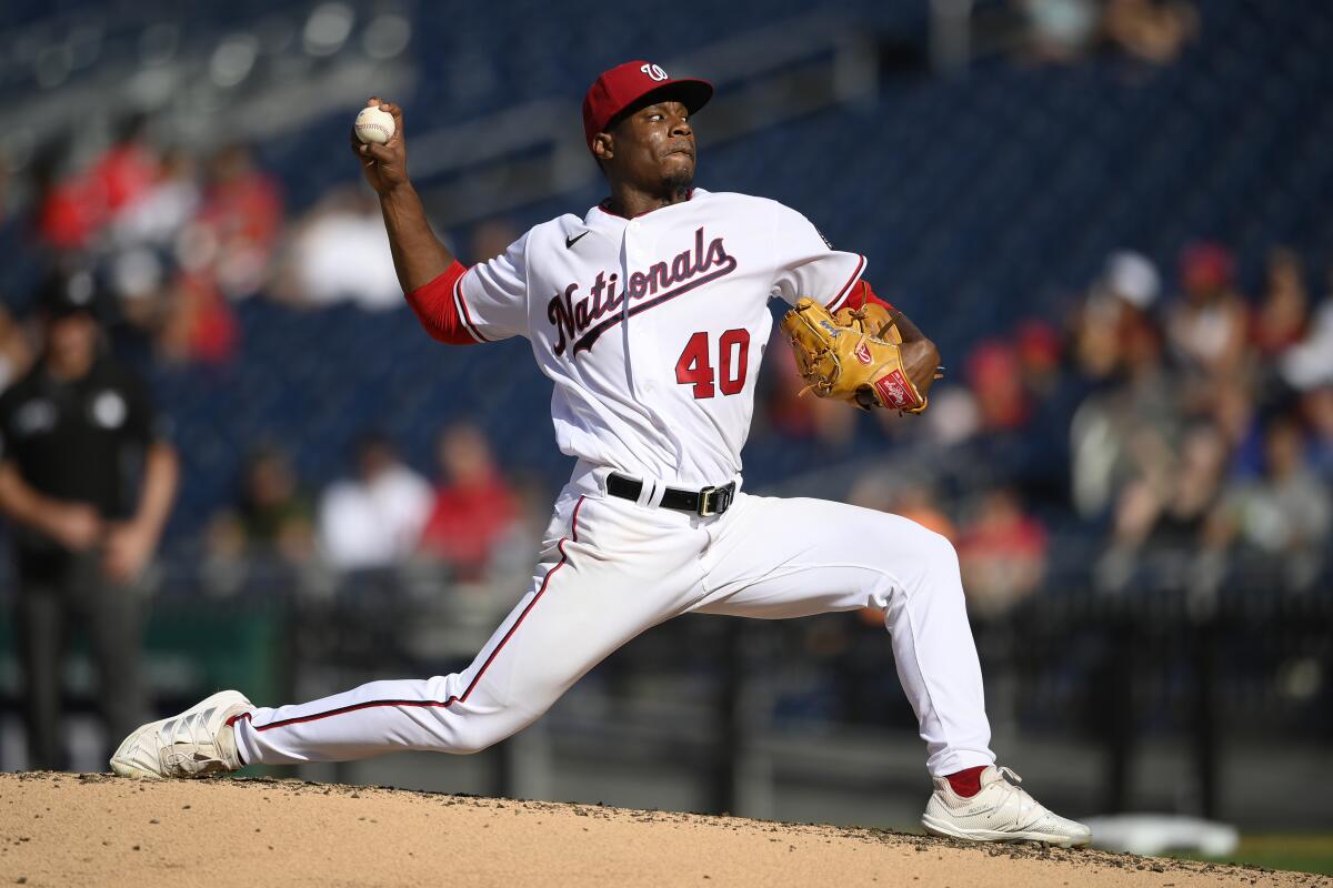 Washington Nationals starting pitcher Josiah Gray delivers a pitch during a baseball game.