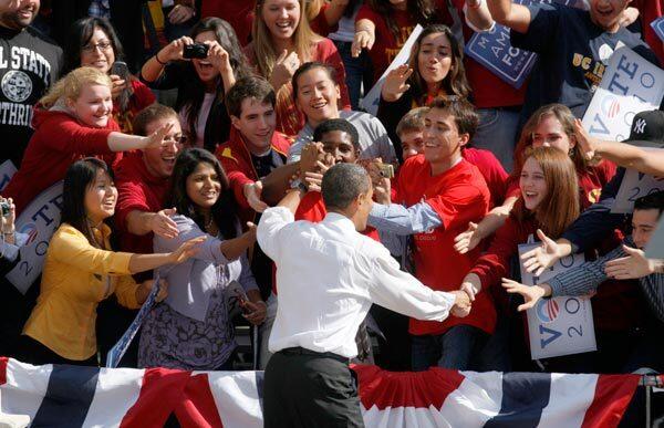 President Barack Obama greets students upon his arrival at the Moving America Forward Rally at USC. See full story