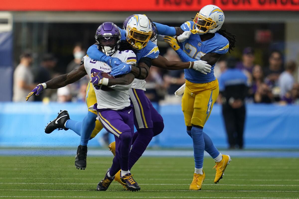 Minnesota Vikings running back Dalvin Cook is tackled by Chargers free safety Derwin James.