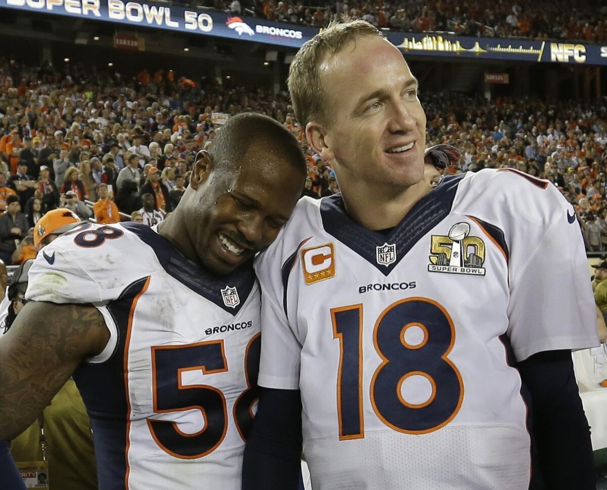 Denver’s Von Miller, left, and Peyton Manning celebrate after the Broncos beat Carolina in Super Bowl 50.