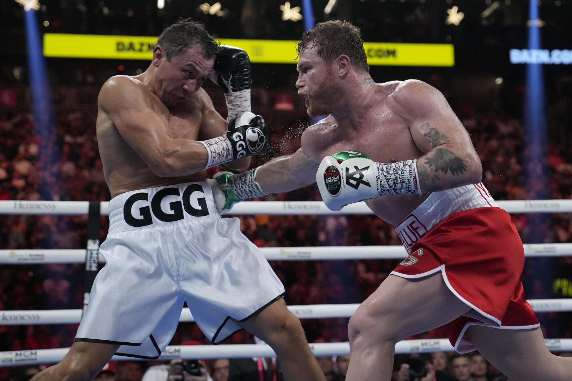 Canelo Alvarez, right, fights Gennady Golovkin in a super middleweight title boxing match Saturday in Las Vegas. 
