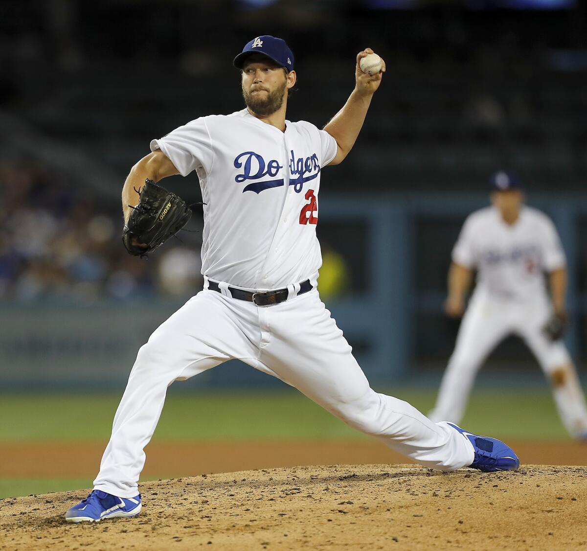 Dodgers ace Clayton Kershaw delivers a pitch against the St. Louis Cardinals in the fourth inning on Tuesday at Dodger Stadium.