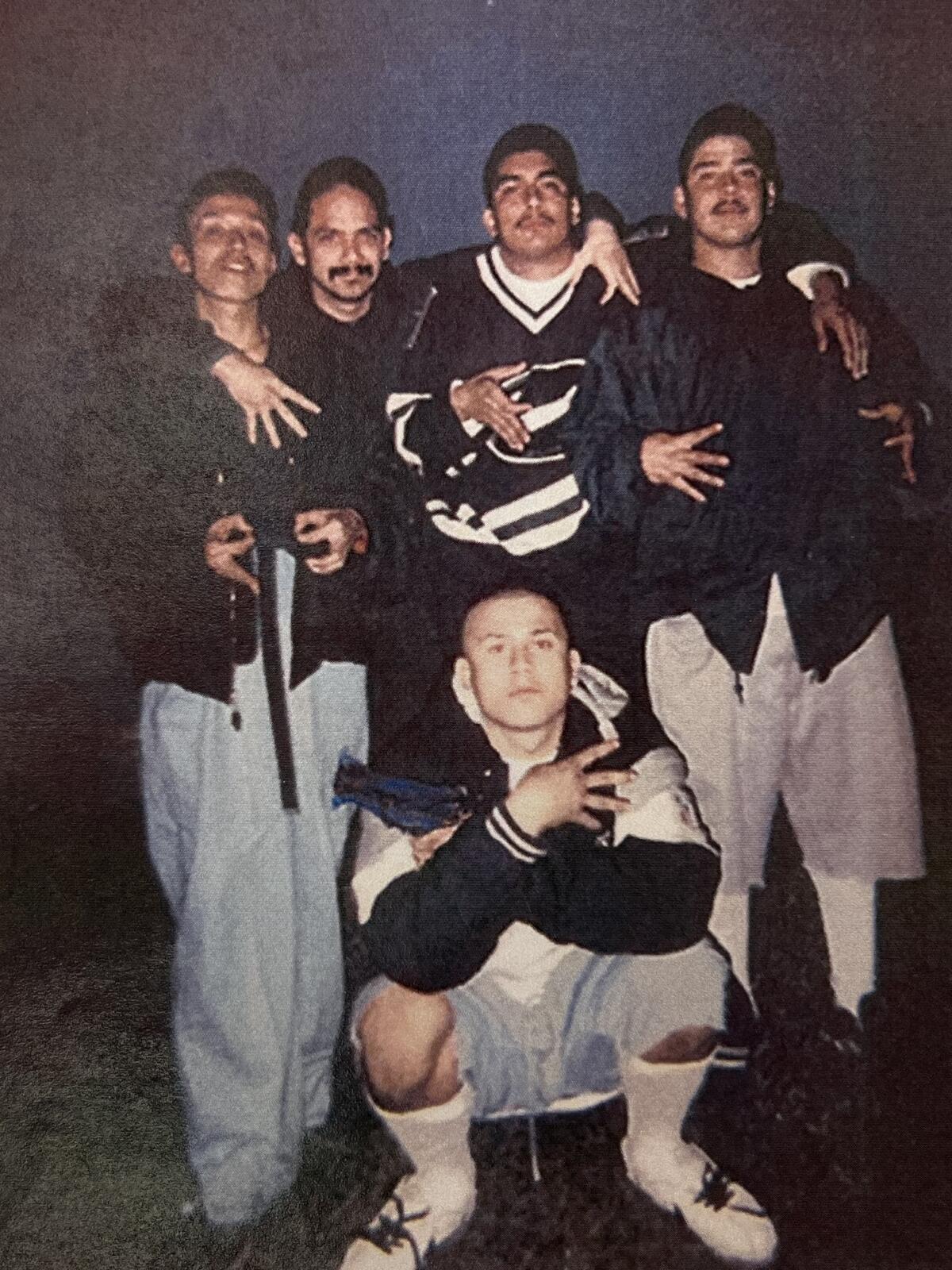 Jose Saenz, shown squatting in the foreground, was a member of the Cuatro Flats gang nicknamed Smiley.