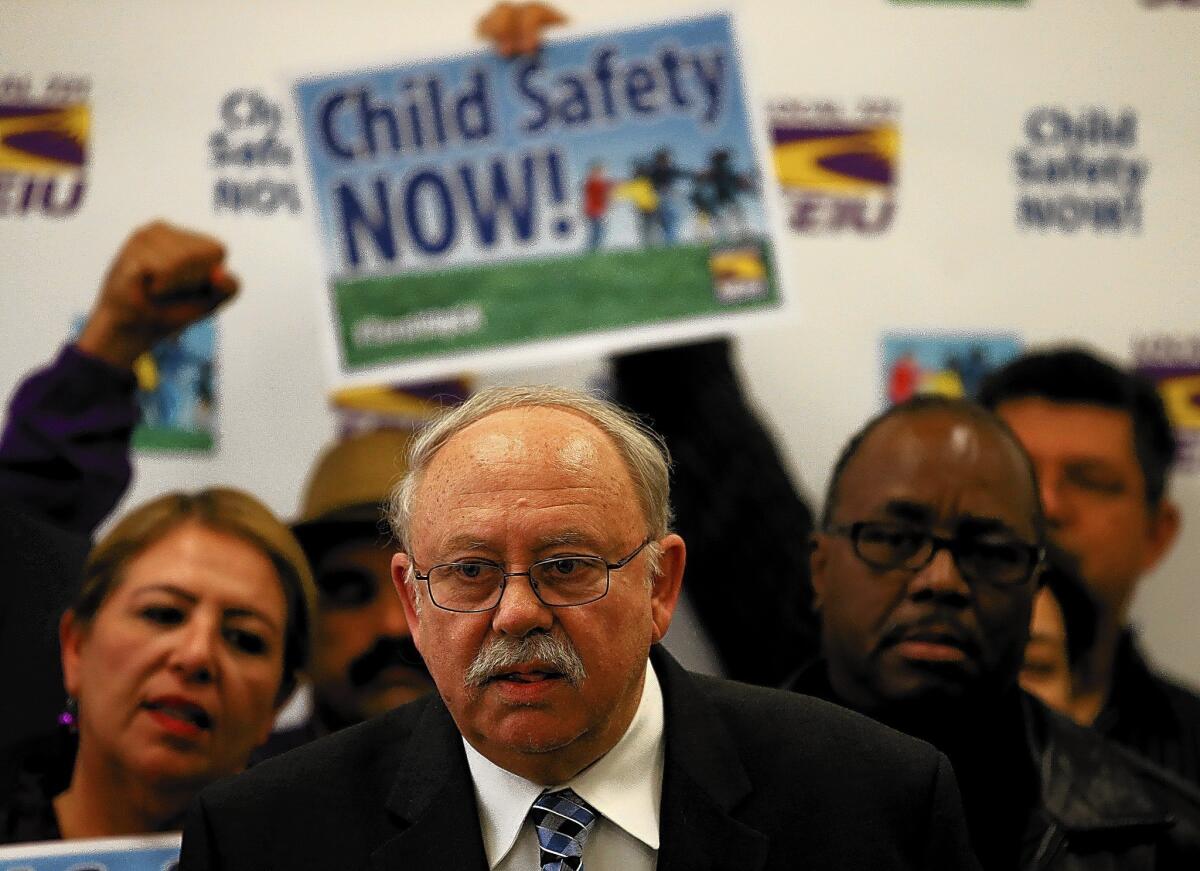 Bob Schoonover, president of SEIU Local 721, announces that union social workers have come to a tentative contract agreement with Los Angeles County, during a press conference at SEIU headquarters Friday.