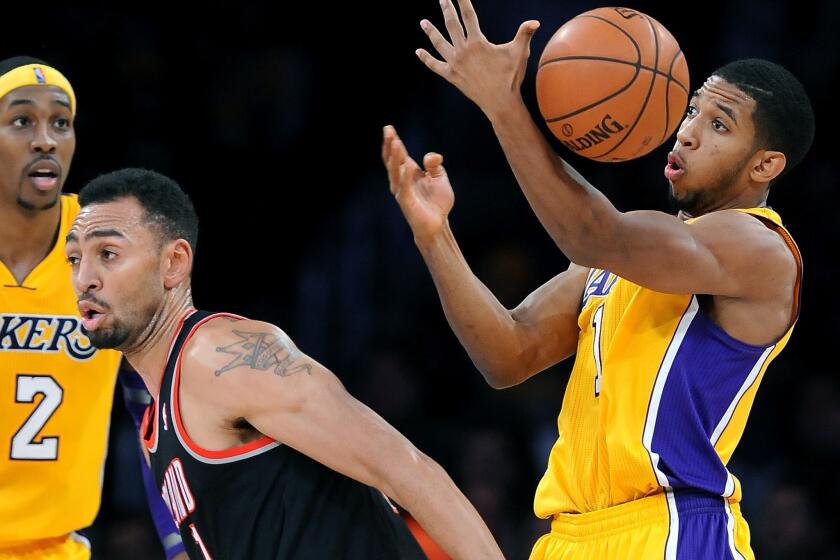 Darius Morris steals the ball away from the Trail Blazers' Jared Jeffries in the second quarter.