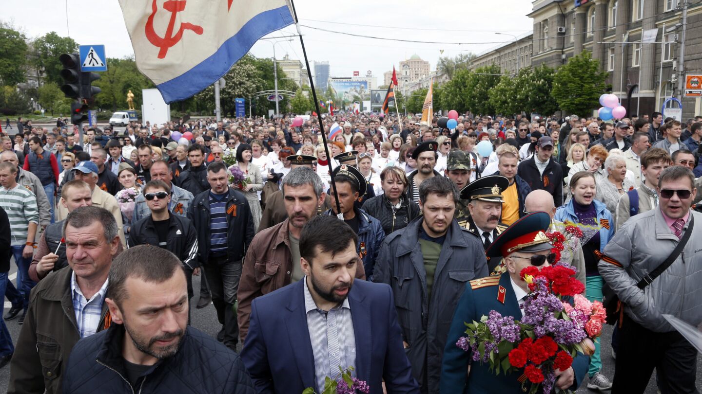 Denis Pushilin, center front, a chairman of the self-declared Donetsk People's Republic takes part in the Victory Day anniversary event in Donetsk, Ukraine.
