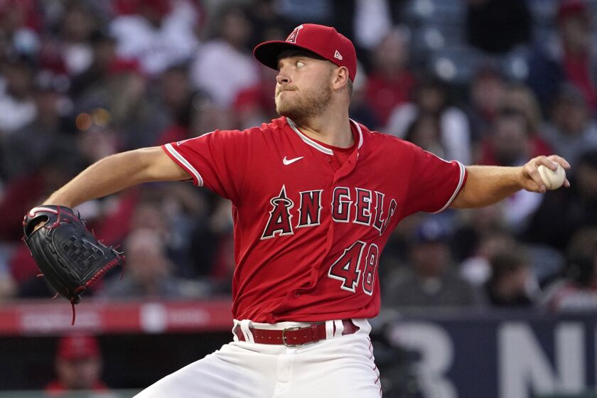 Los Angeles Angels starting pitcher Reid Detmers throws to the plate during the third inning.
