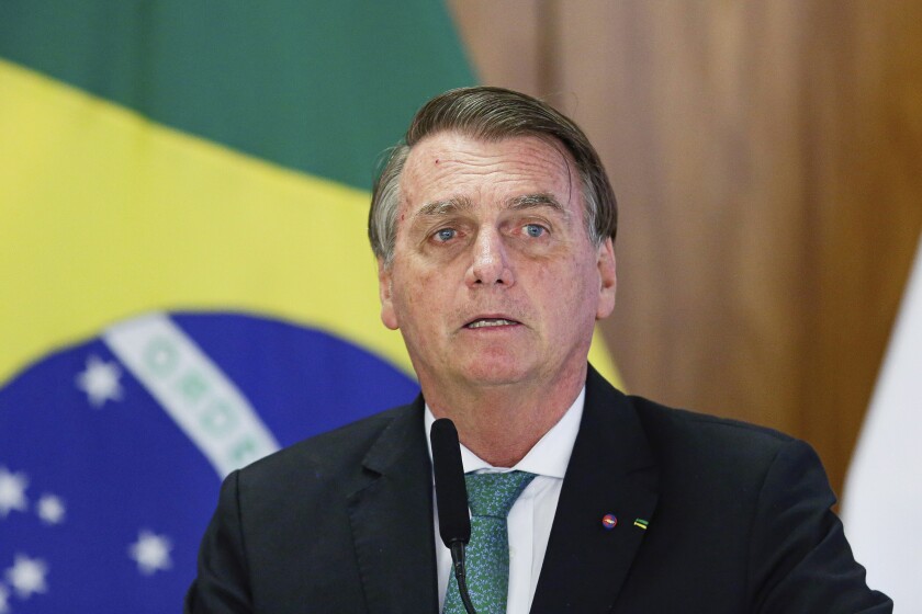 FILE - Brazil's President Jair Bolsonaro speaks during a joint press conference Paraguay's president at the Planalto Palace in Brasilia, Brazil, Nov. 24, 2021. Bolsonaro was taken to a Sao Paulo hospital early Monday, Jan. 3, 2022, with a suspected intestinal obstruction, the country’s media reported. (AP Photo/Raul Spinasse, File)