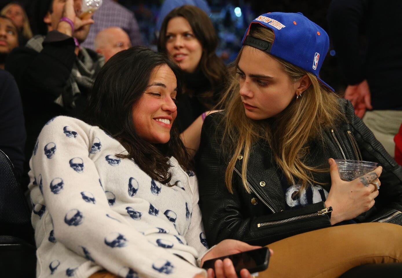 Michelle Rodriguez and Cara Delevingne lock lips
