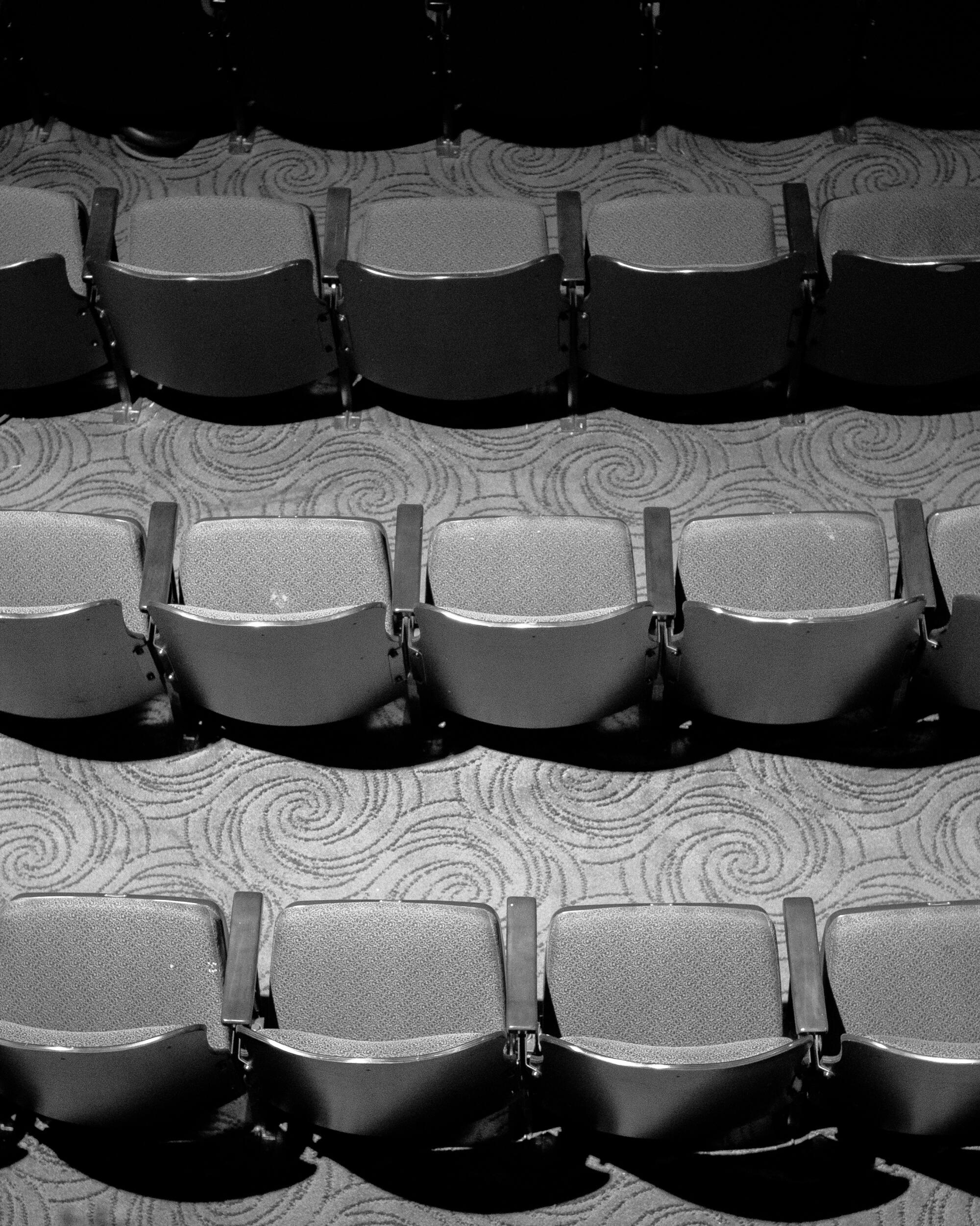 Rows of empty theater seats 