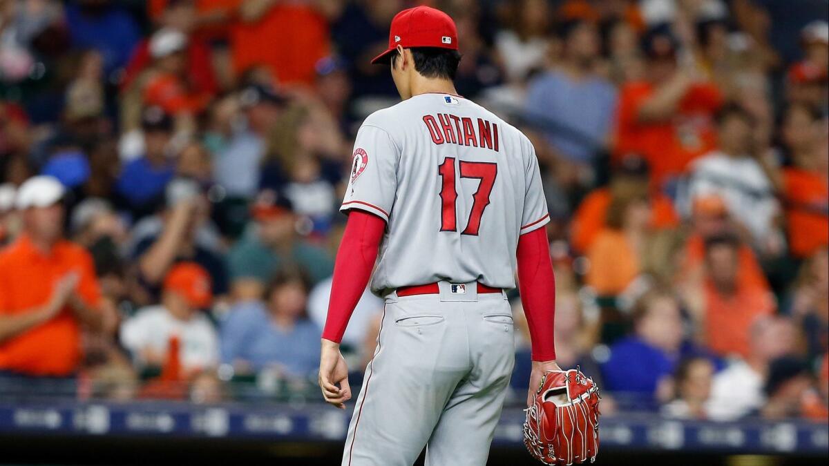 Angels pitcher Shohei Ohtani leaves the game in the third inning against the Houston Astros on Sunday in Houston.