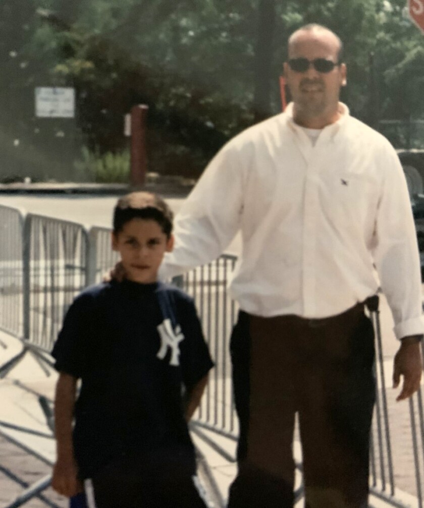 Angels midfielder Andrew Velazquez, left, with his father, Kenneth.