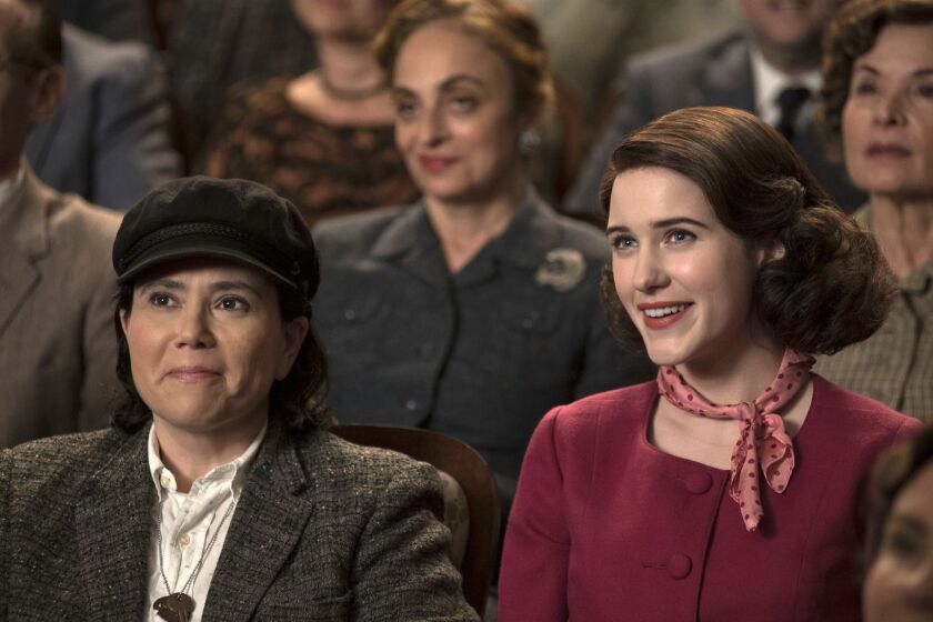 This image released by Amazon shows Alex Borstein as Susie Myerson, left, and Rachel Brosnahan as Midge Maisel in "The Marvelous Mrs. Maisel." (Nicole Rivelli/Amazon via AP)