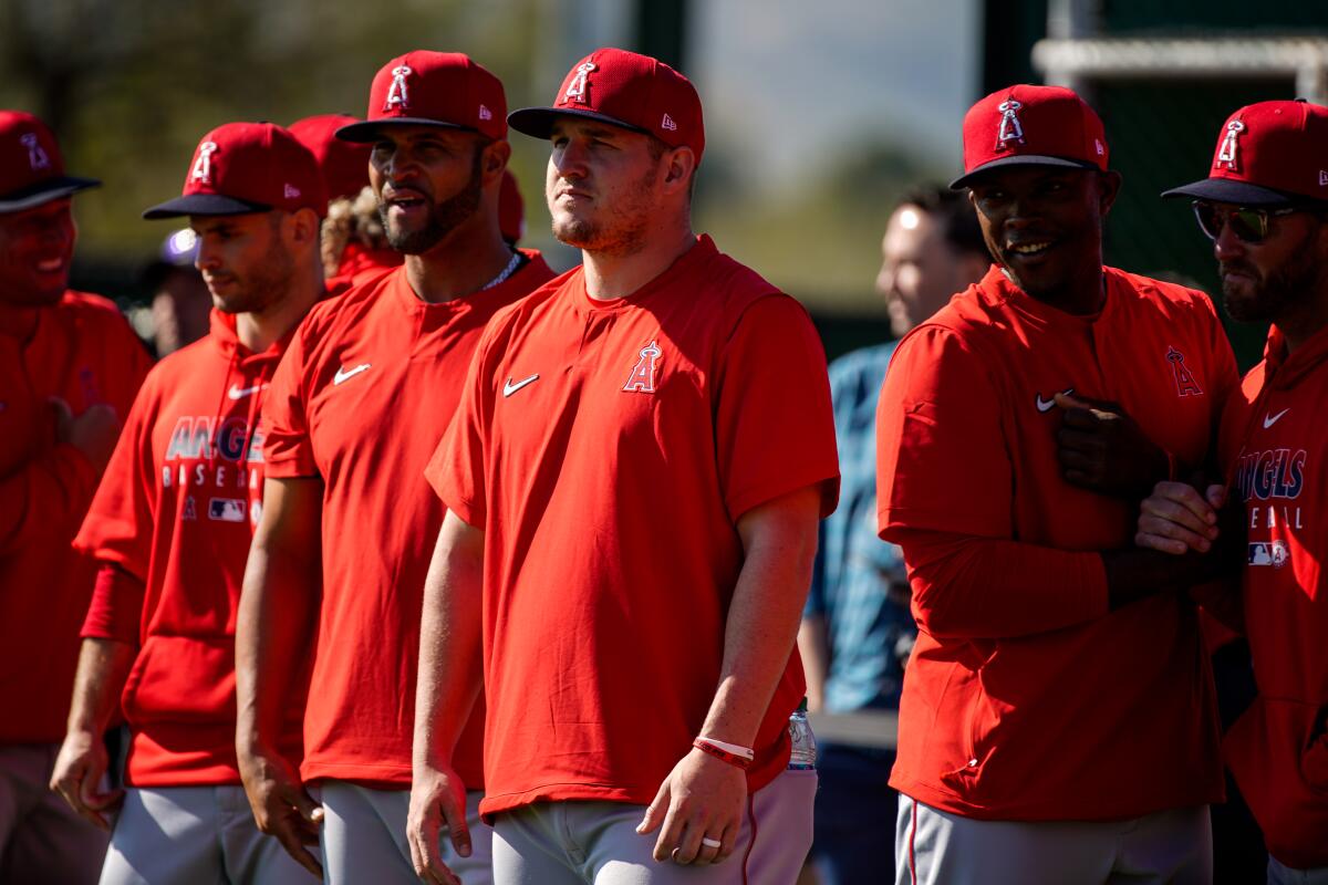 Angels center fielder Mike Trout (27), center, and the Angels at practice at Tempe Diablo Stadium on Feb. 17.