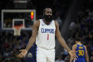 Los Angeles Clippers guard James Harden reacts after being called for a foul during the first half.