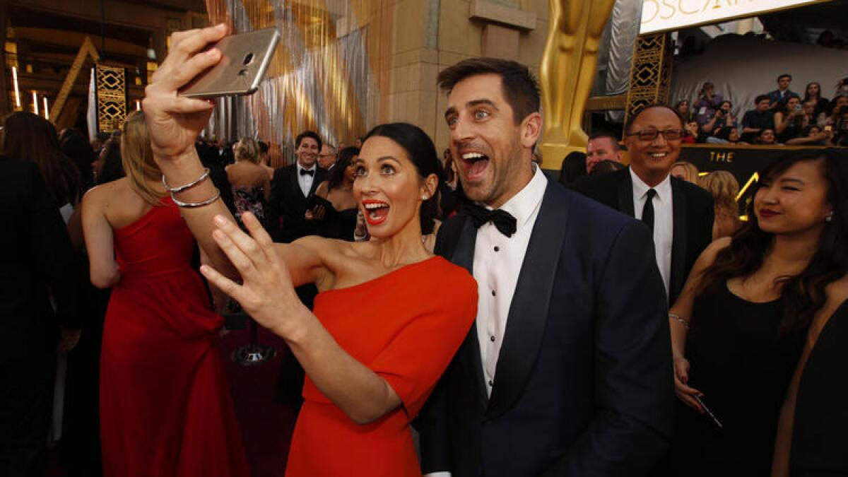 Olivia Munn and Aaron Rodgers at the Academy Awards in February 2016.