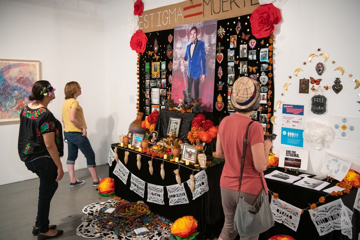 A Day of the Dead altar, "Altar for Carlos Zaragoza," at Self Help Graphics & Art's community arts workshop last year. 
