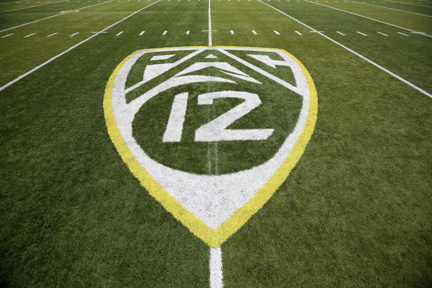 FILE- In this Oct. 10, 2015, file photo, a PAC-12 logo is displayed on the field before an NCAA college football game between Washington State and Oregon in Eugene, Ore. The Pac-12 will provide more access to players and coaches during broadcasts of football games next season, including in-game coaches interviews and halftime camera access. The changes will be implemented throughout football broadcasts on ESPN, Fox Sports and the Pac-12 Networks. (AP Photo/Ryan Kang, File)