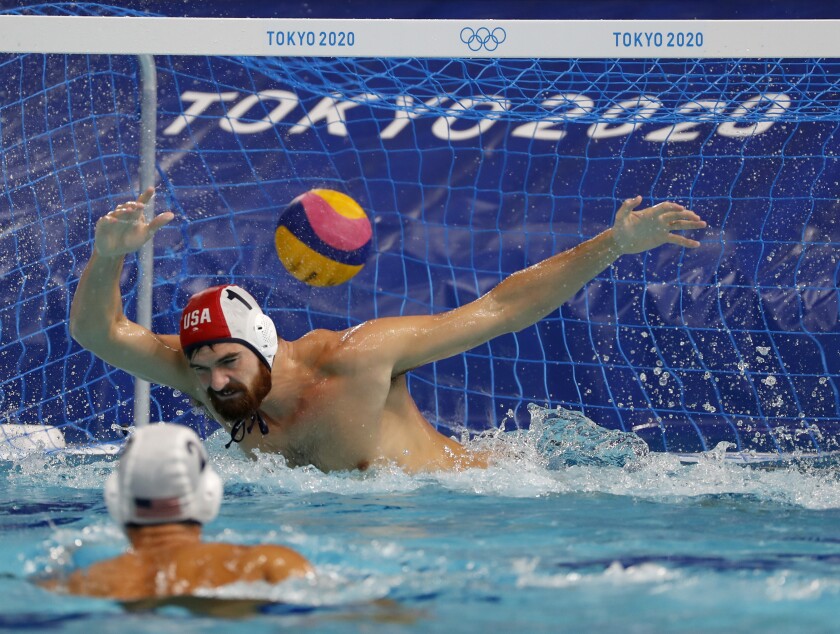 U.S. goalie Alex Wolf tries to stop a shot by Spain'ss Alberto Manarriz Egana.