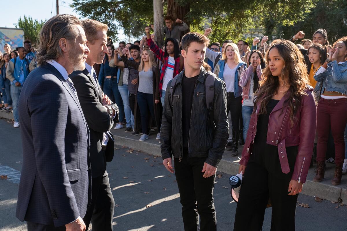 Students Clay Jensen (Dylan Minnette) and Jessica Davis (Alisha Boe) confront school officials in "13 Reasons Why."