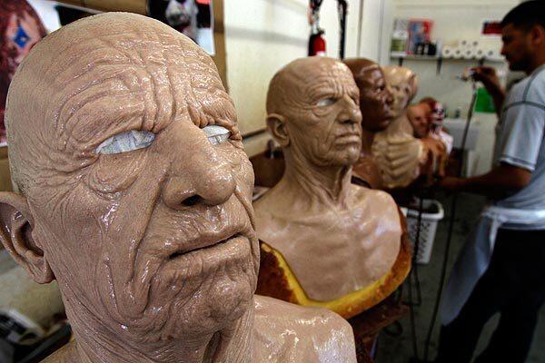 At SPFXMasks in Van Nuys, a six-person crew uses silicone that looks and feels like flesh, down to the pores. Artists methodically paint the masks to create realistic skin tones. Above left, a mask called "The Elder."