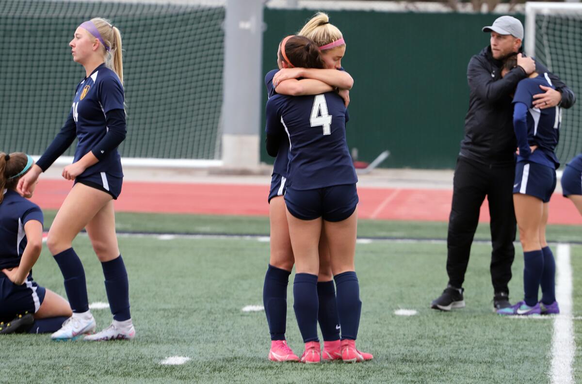 Marina High girls' soccer players react after losing to Moorpark, 2-1 in overtime, in the CIF  title match on Saturday.
