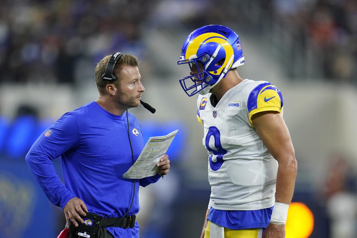 Rams coach Sean McVay and quarterback Matthew Stafford talk against the Chicago Bears on Sept. 12, 2021.