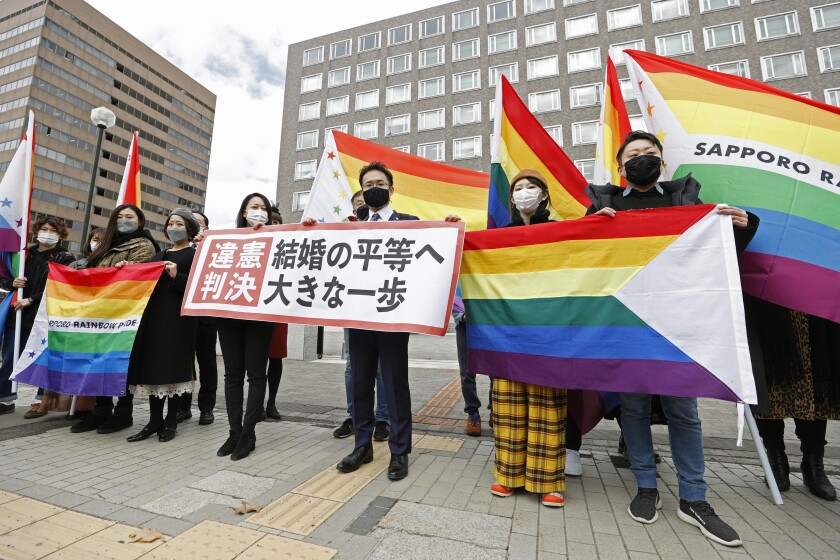 Protesters carry banners in Japan. 