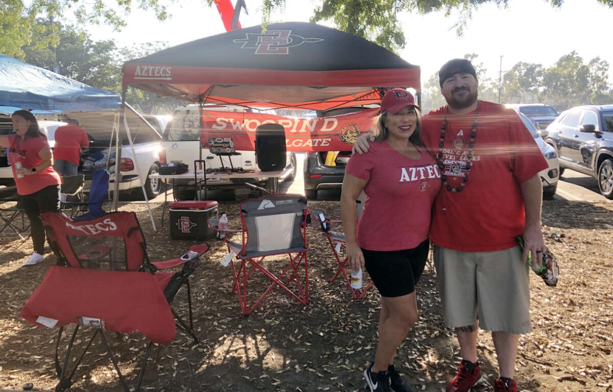 Donney and Deb Cummins of Escondido are tailgate veterans in Carson after coming three previous years for Chargers games.
