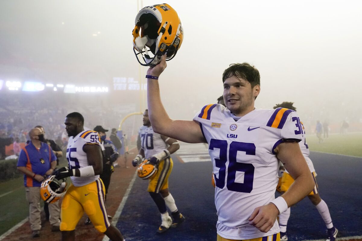 LSU's Cade York (36) celebrates as he comes off the field after kicking a field goal against Florida in the final minute of an NCAA college football gam Saturday, Dec. 12, 2020, in Gainesville, Fla. LSU won 37-34. (AP Photo/John Raoux)