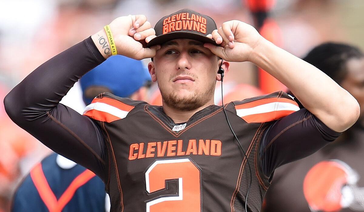 Cleveland's Johnny Manziel looks on from the sidelines against Oakland on Sunday.