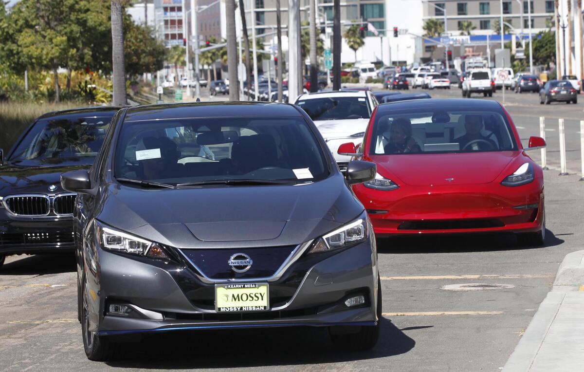 A Nissan Leaf and a Tesla Model 3 were available for test drives in San Diego during a "drive and ride" event.