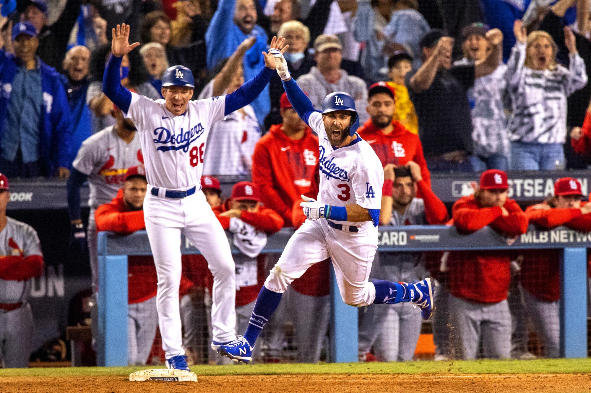 Chris Taylor reacts while running the bases after his two-run homer wins the game.