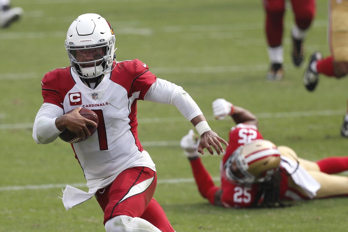 Arizona Cardinals quarterback Kyler Murray runs past San Francisco 49ers cornerback Richard Sherman on Sept. 13.