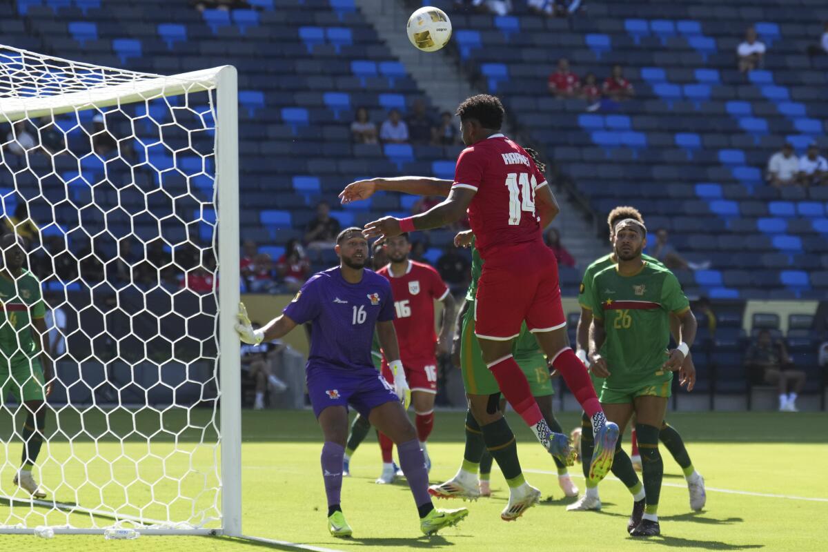Panama defender Carlos Harvey (14) heads the ball