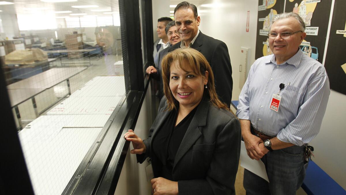 Patty Lopez with supporters at the ballot counting room last week.