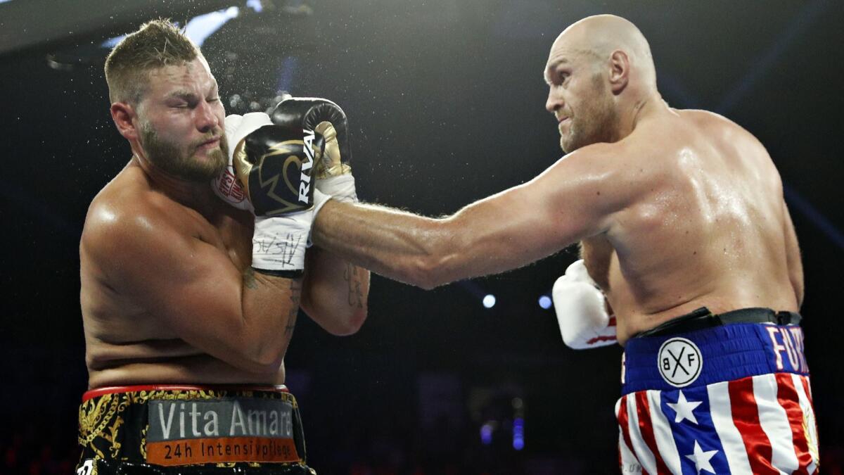 Tyson Fury lands a left to Tom Schwarz during a heavyweight boxing match on Saturday in Las Vegas.