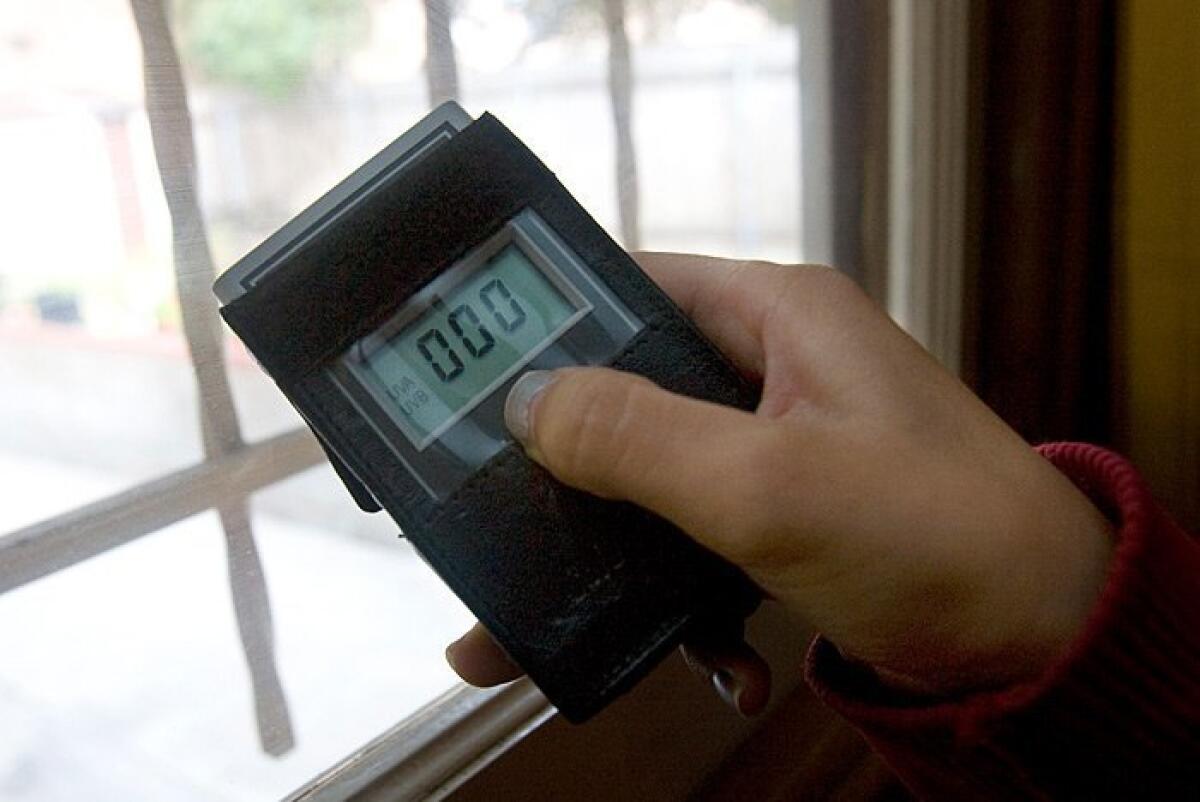 Andrea uses this lifesaving meter to detect the presence of UV rays. It showed the effectiveness of the new, special window tints at the family home. Nelvin C. Cepeda / Union-Tribune