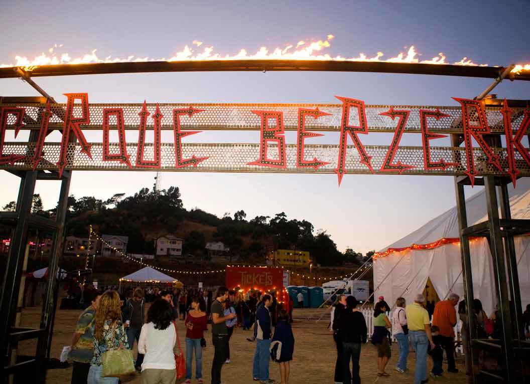 Cirque Berzerk's blazing sign welcomes visitors to it's big top n Los Angeles State Historic Park. With masks and characters that look as though they'd be at home in Jack Skellington's world, the 35-member troupe presents "Beneath," its first full-length extravaganza. The new show tells a twist on the Greek myth of Orpheus, who descends into the underworld to rescue his beloved Eurydice.